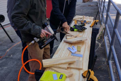 Students working together on woodworking